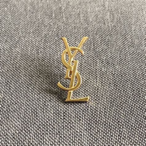 YSL brooches and pins